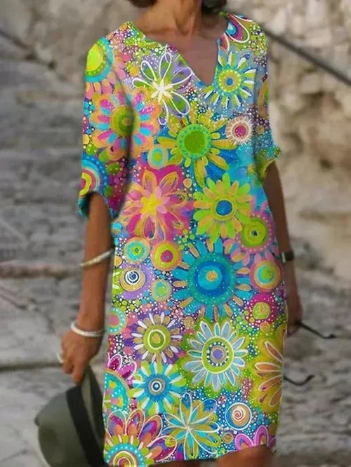 Angelique | Strahlendes Blumen-Midi-Kleid.